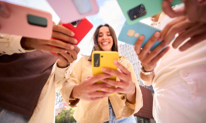caucasian-girl-looking-at-happy-cell-phone-low-an-2026-03-17-17-44-36-utc-2