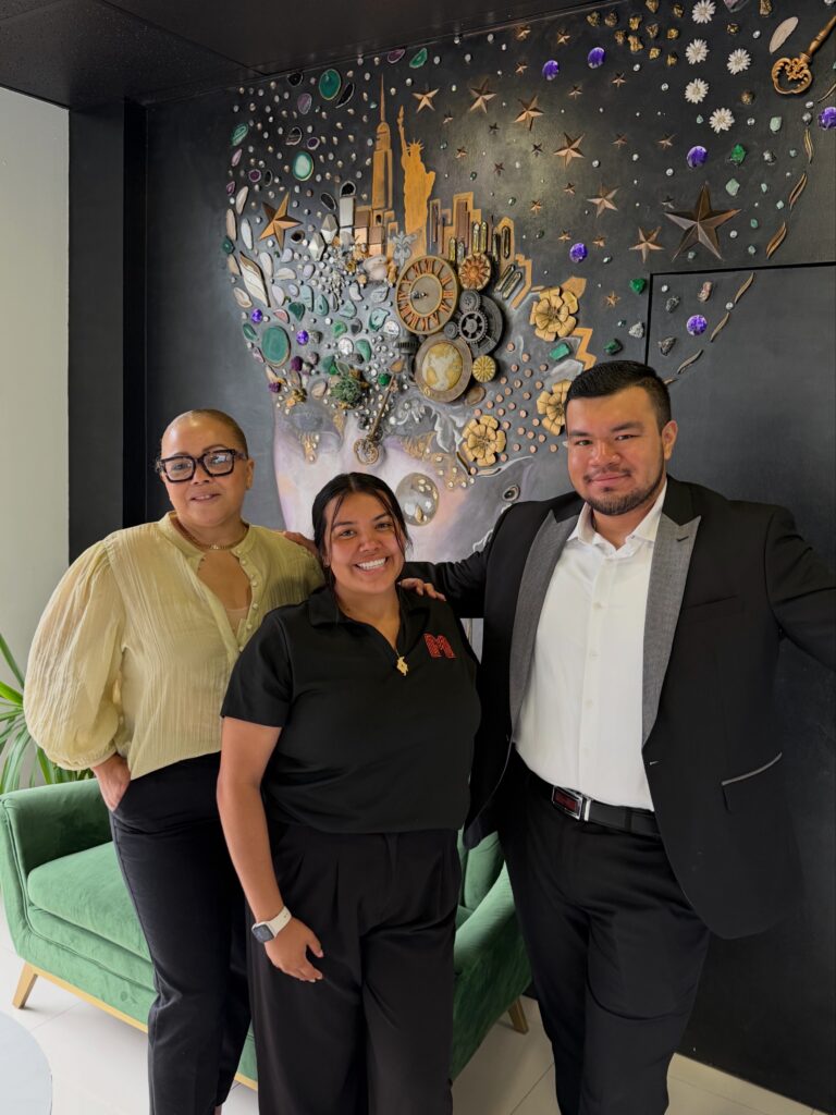 Maze Marketing team members with a client