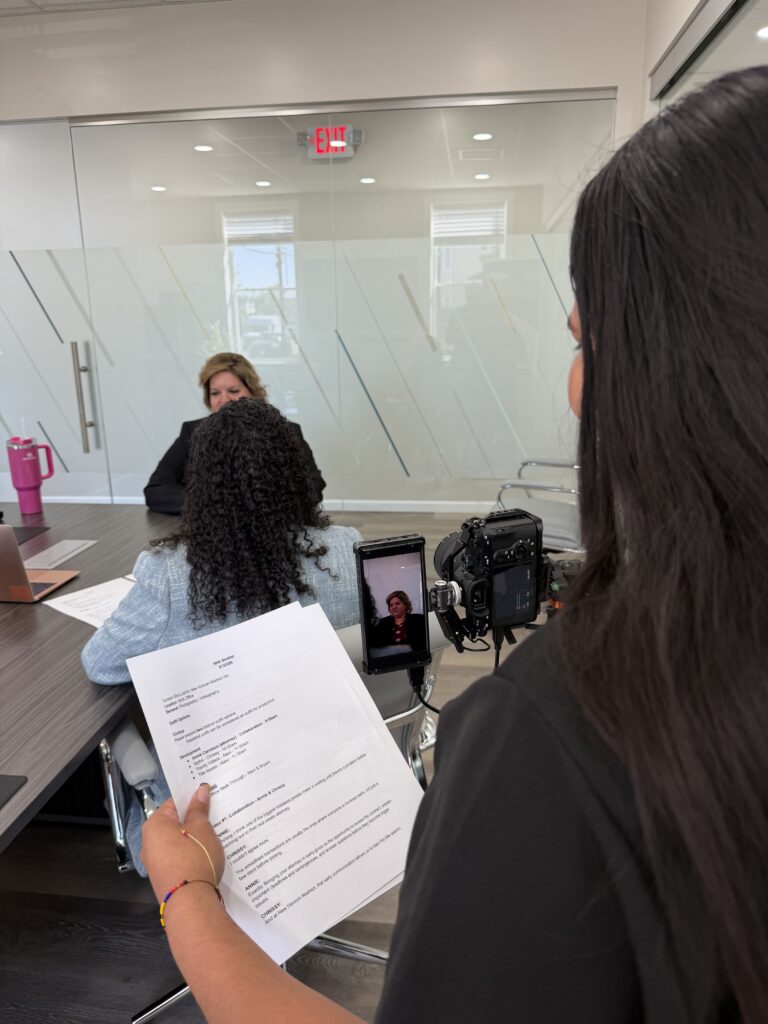 Maze team member directing a shoot with a script