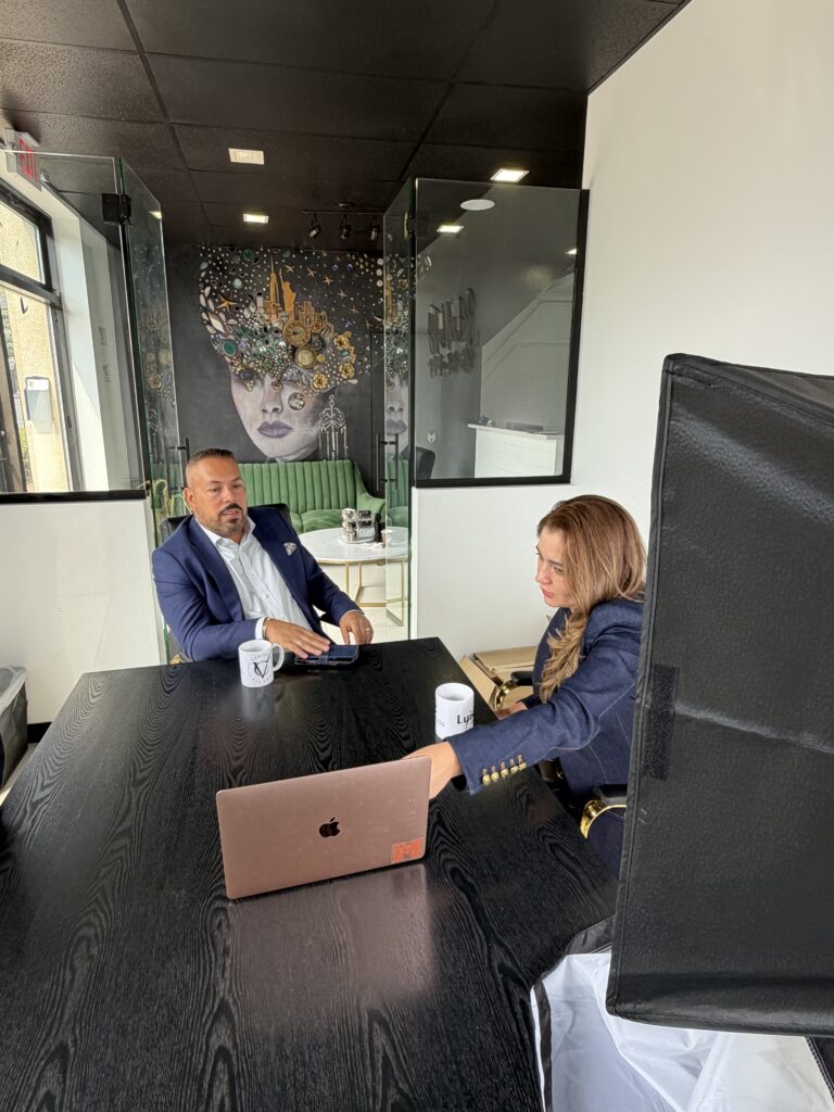 Maze meeting with a client at their office