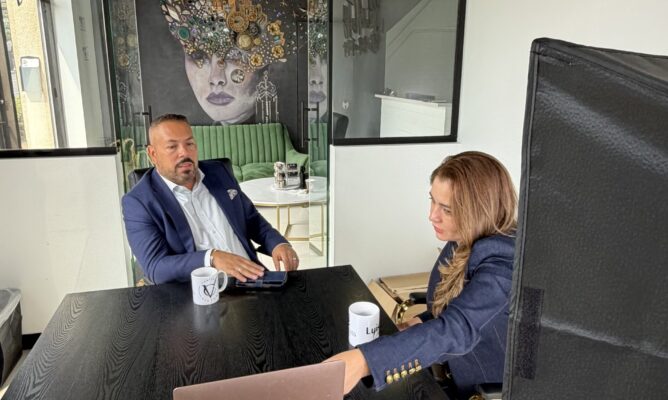 Maze meeting with a client at their office