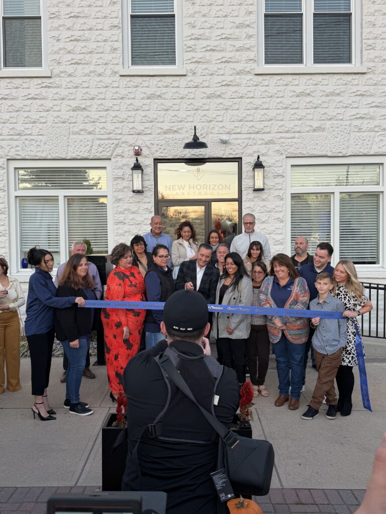 Maze filming a client ribbon cutting