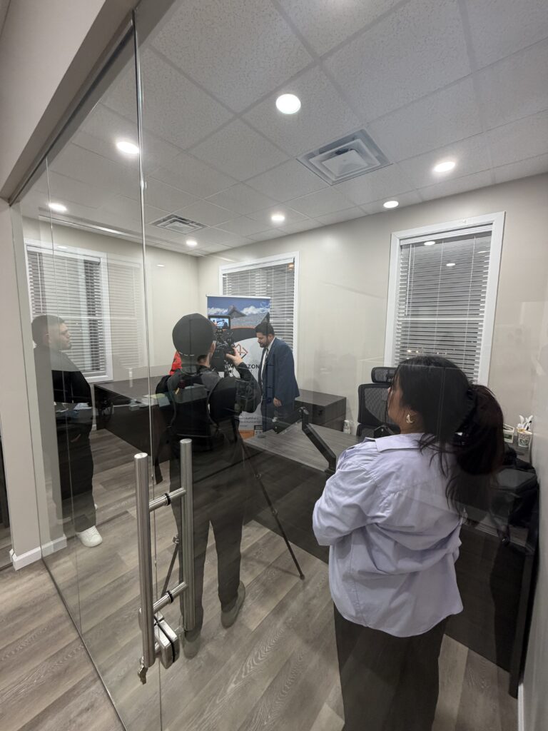 Maze filming inside a client glass office