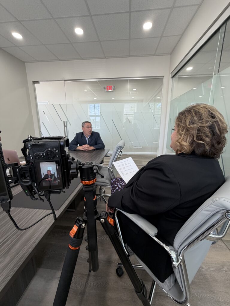 Maze filming a client interview