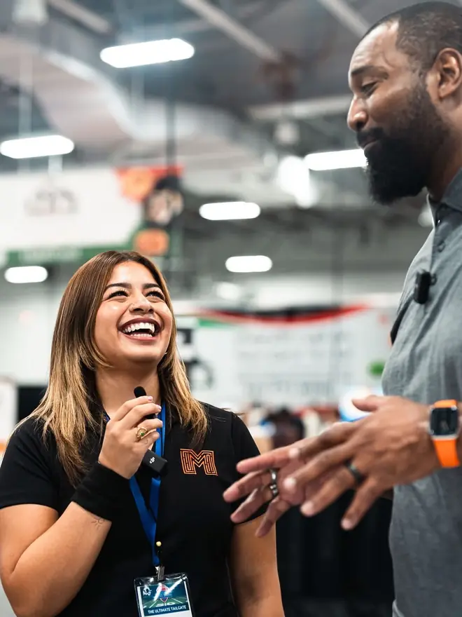 Maze Marketing team member interviewing a guest at the Maximum Quality Foods food show